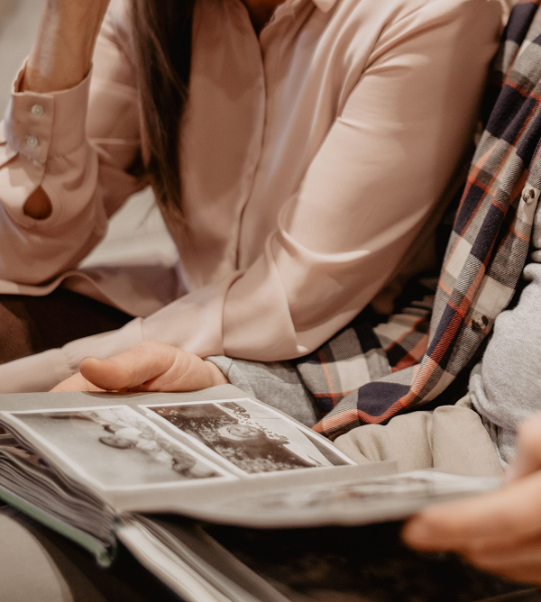 family looking at photo album